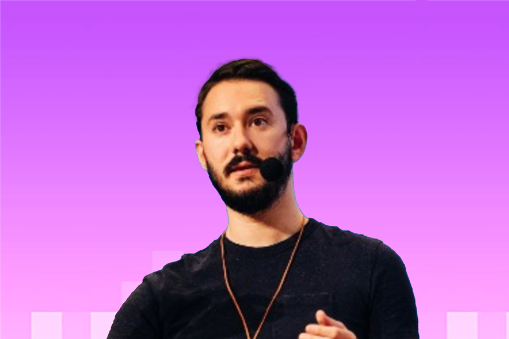 Headshot of Adrián Bolonio giving a talk with microphone.