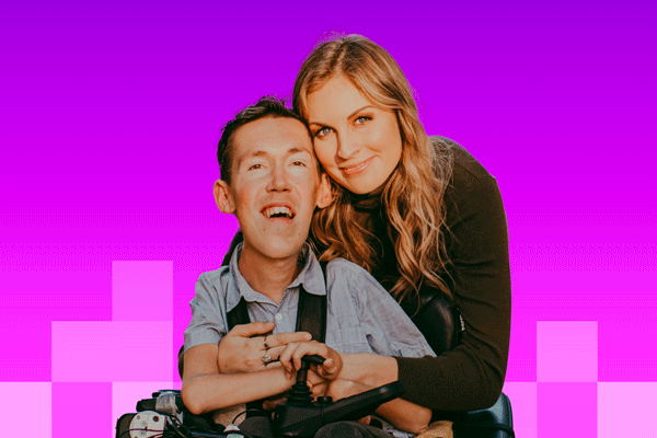 Shane and Hannah Burcaw - Hannah is a blonde woman wearing a green sweater dress and Shawn is a blonde man in a wheelchair
