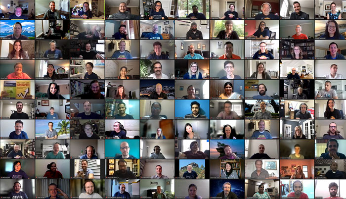 100 smiling Deque employees each on a Zoom call together