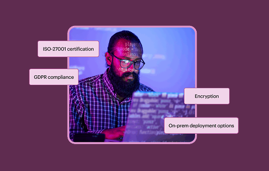 A developer at his laptop with pop out word blocks that say ISO-27001 certification, GDPR compliance, Encryption, and On-prem deployment options.