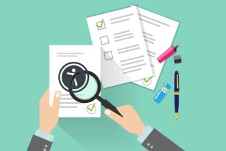 Illustration of magnifying glass over audit report