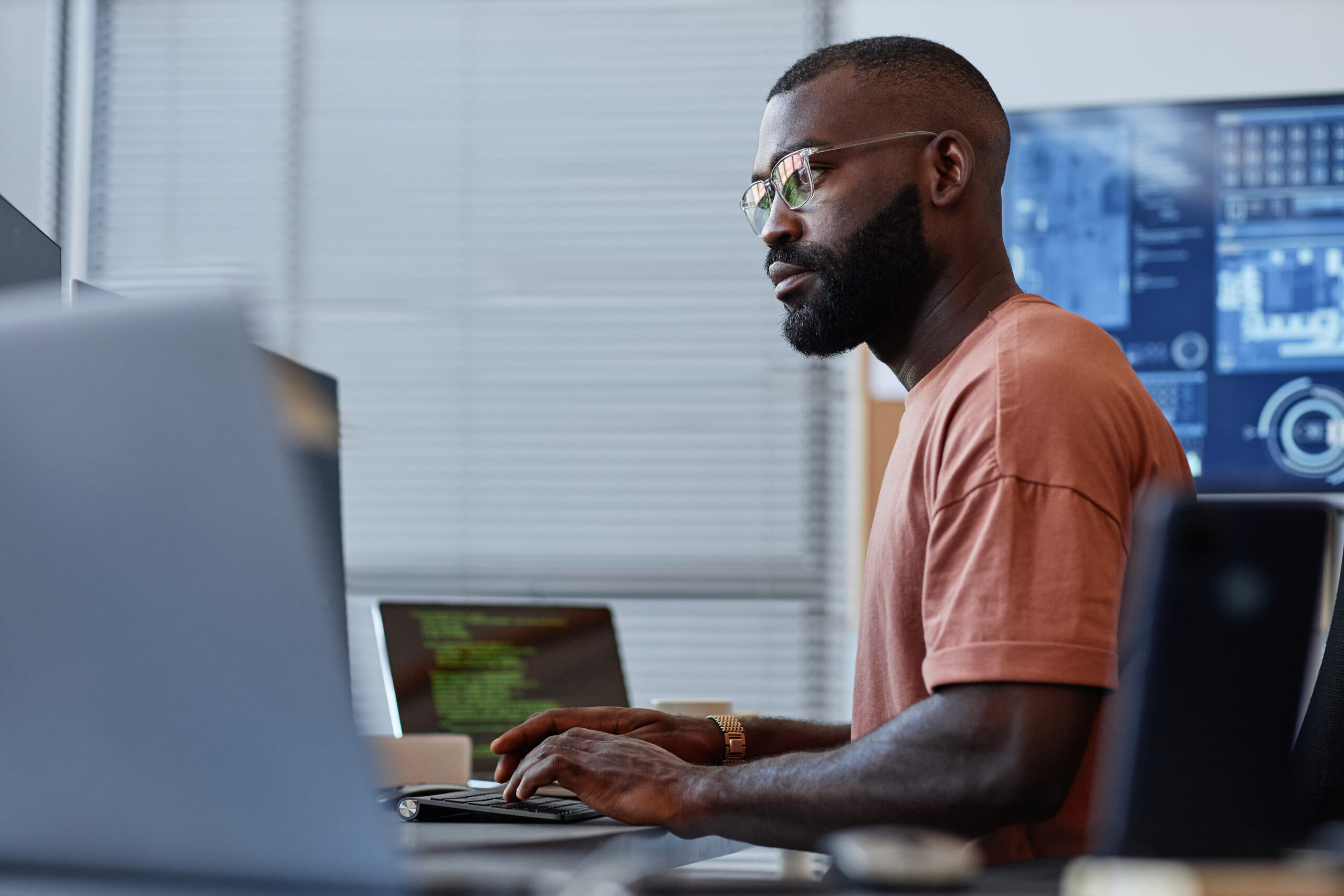 Man with glasses working at desk