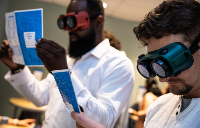 Two Awareness lab participants interacting at an event station