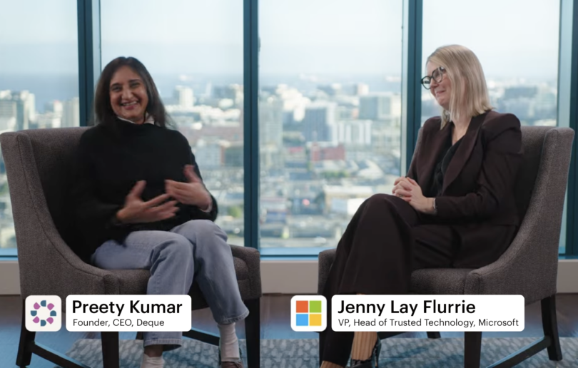 Preety Kumar and Jenny Lay-Flurrie conducting an interview, with the Seattle skyline in the background.