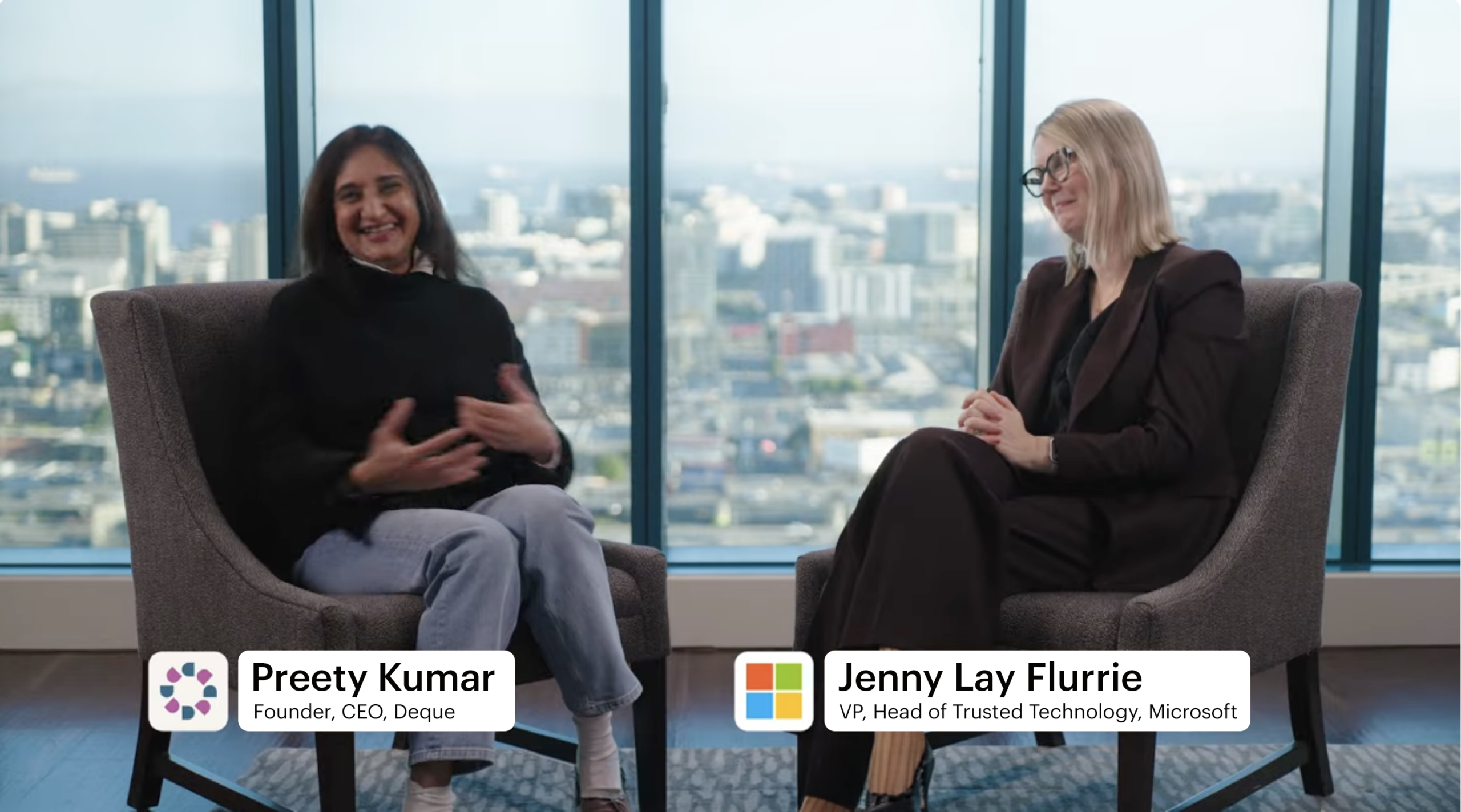 Preety Kumar and Jenny Lay-Flurrie conducting an interview, with the Seattle skyline in the background.